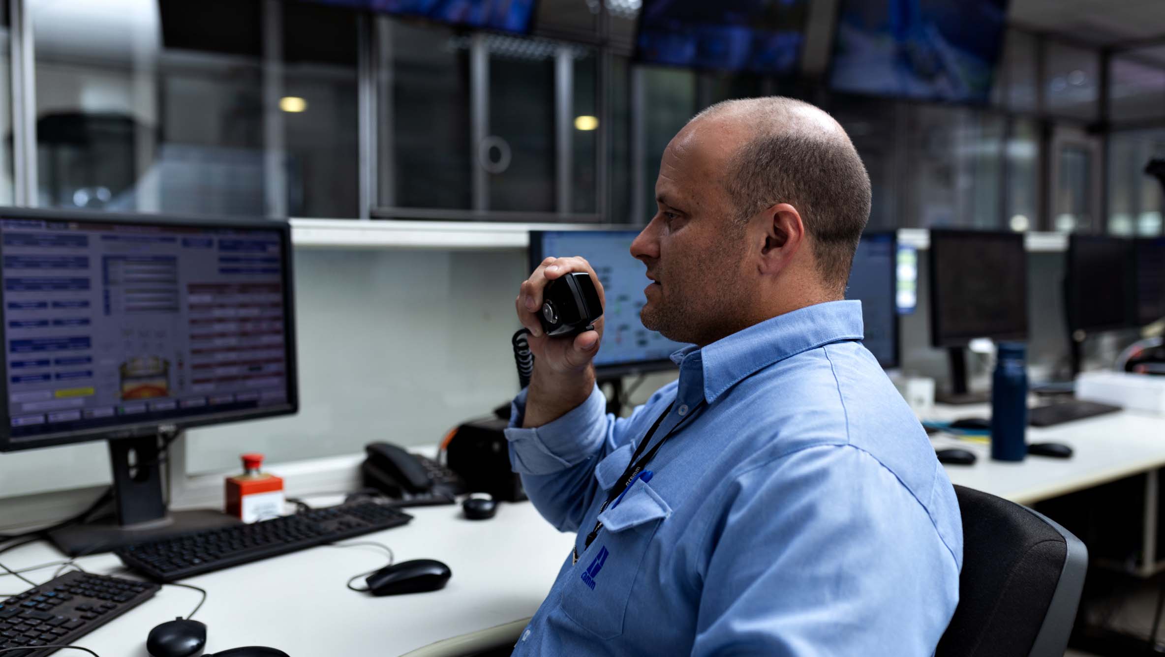 CBMM employee using radio communicator in the operating room
